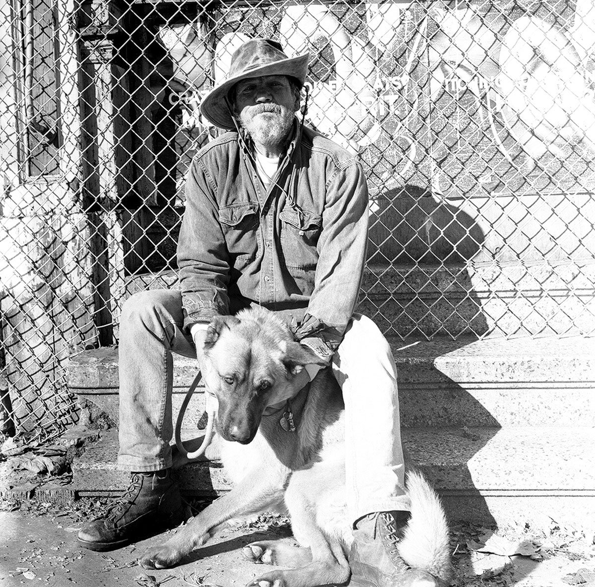 man and dog street life photograph by Victor Arimondi