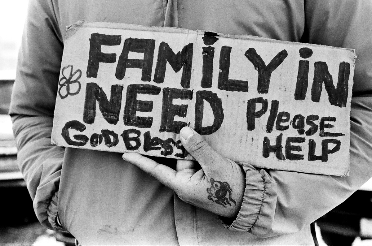 family in need sign street life photograph by Victor Arimondi
