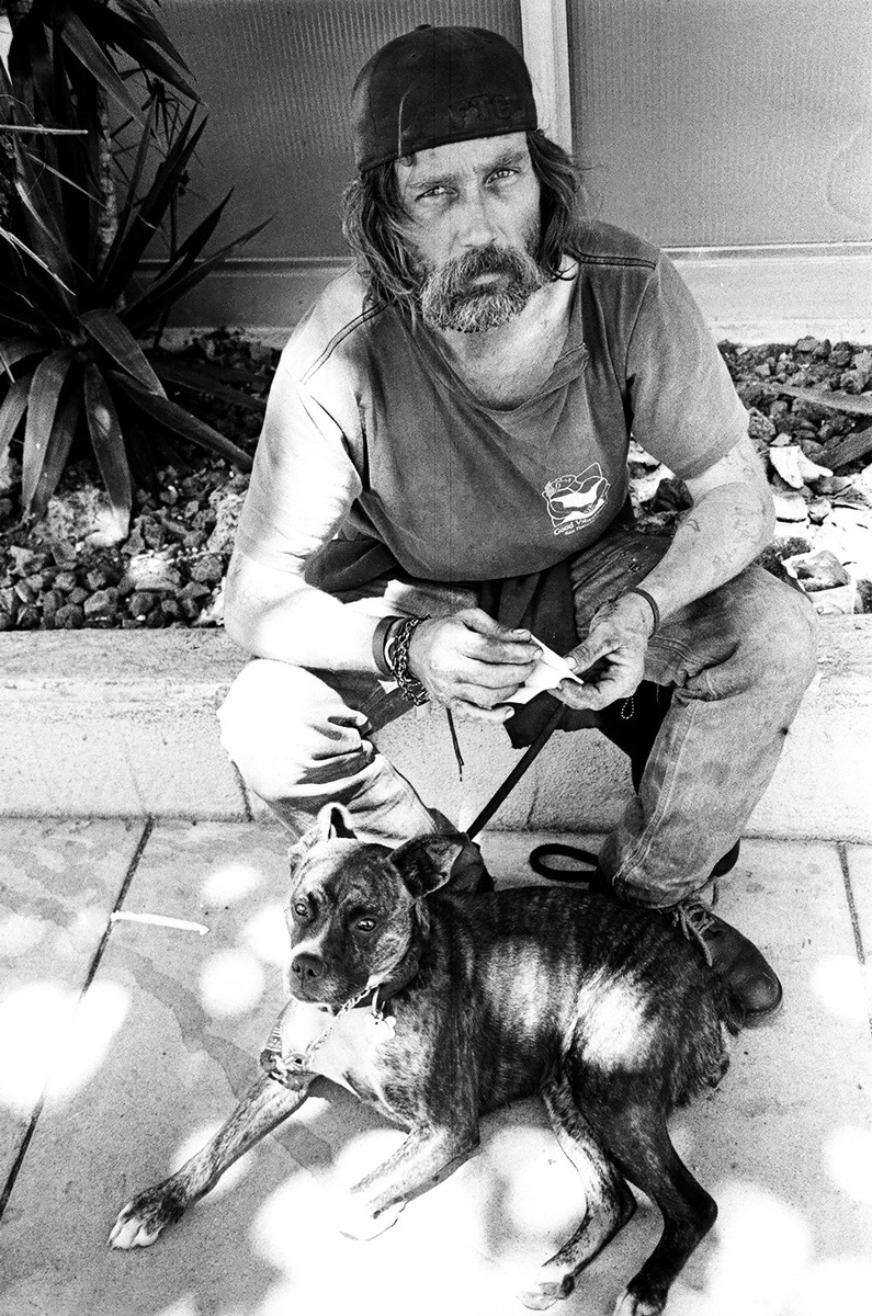 man with dog street life photograph by Victor Arimondi